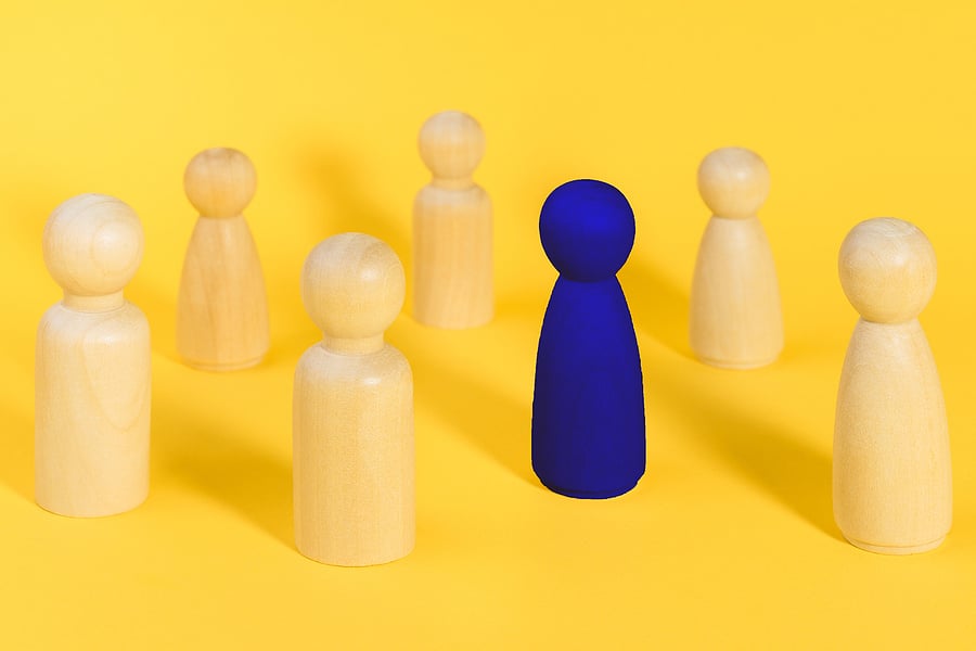 bigstock-Blue-Wooden-Figure-Among-Many--417753487