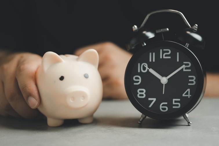 bigstock-Hand-Holding-A-Piggy-Bank-And--470709803